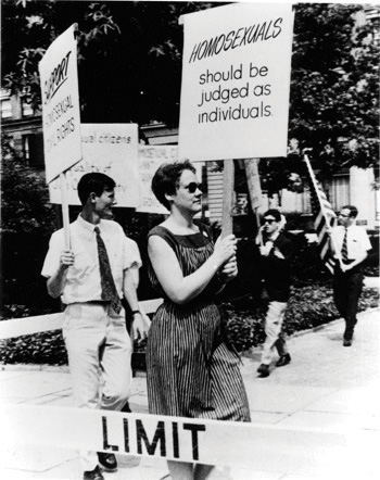 Black-and-white photo of Barbara Gittings picketing the White House in 1965