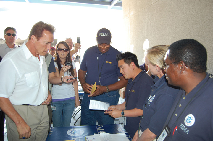 Photo of Arnold Schwarzenegger with members of FEMA.