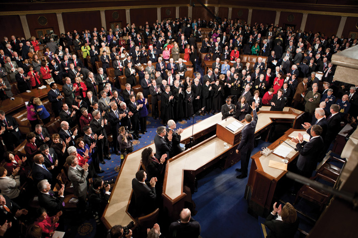 Photo of President Obama waving to the joint session of Congress upon completing the 2011 State of the Union Address.