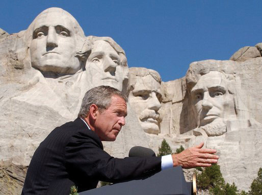 Photo of George W. Bush speaking in front of Mount Rushmore