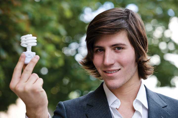 Image of a man holding a light bulb